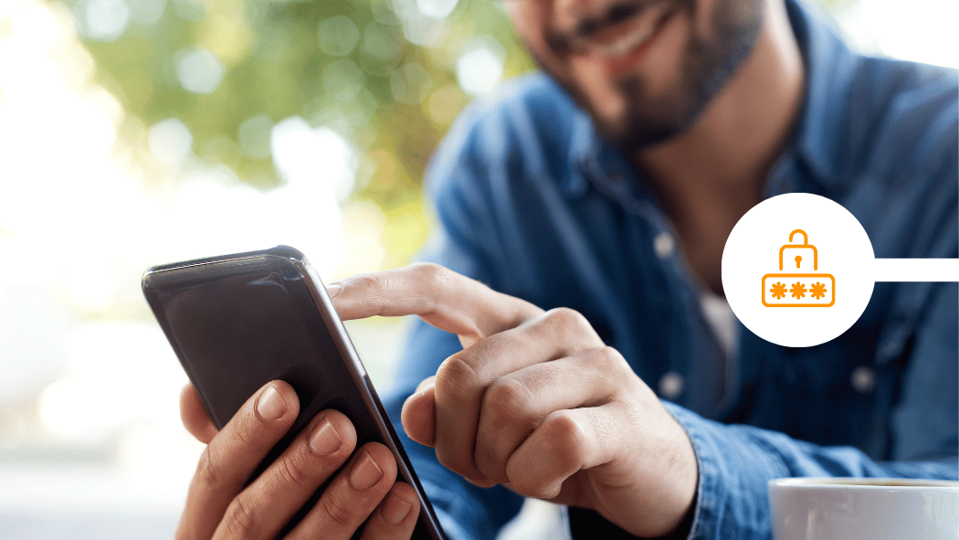 Male consumer using his smartphone outside