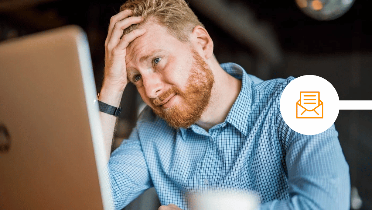 Man making a mistake by email and looking stressed