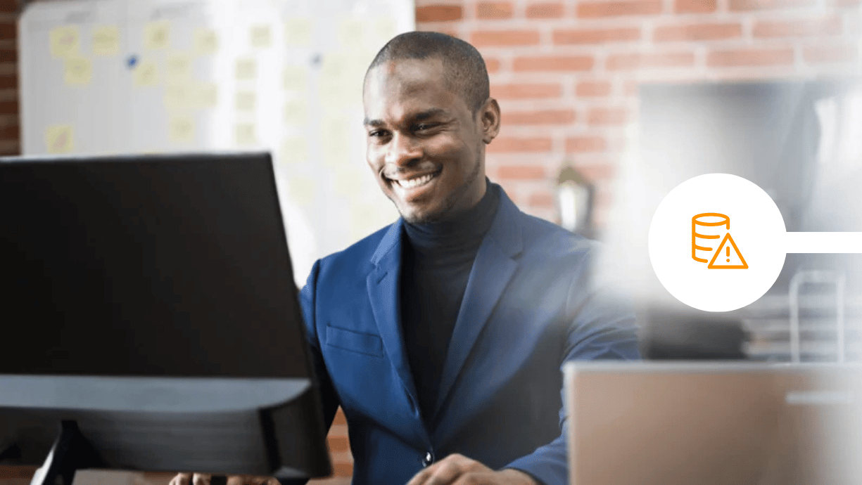 Male professional securing emails in office using laptop