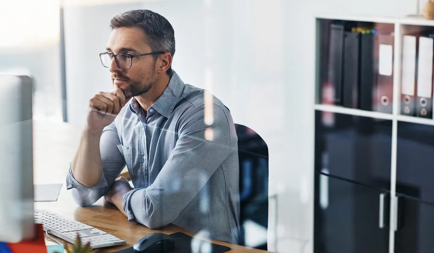 Man sending secure email at office using Outlook