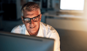 man looking at computer