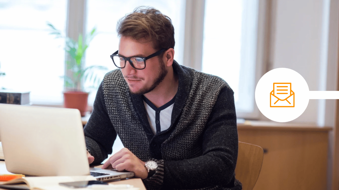 Man sitting with laptop writing secure email