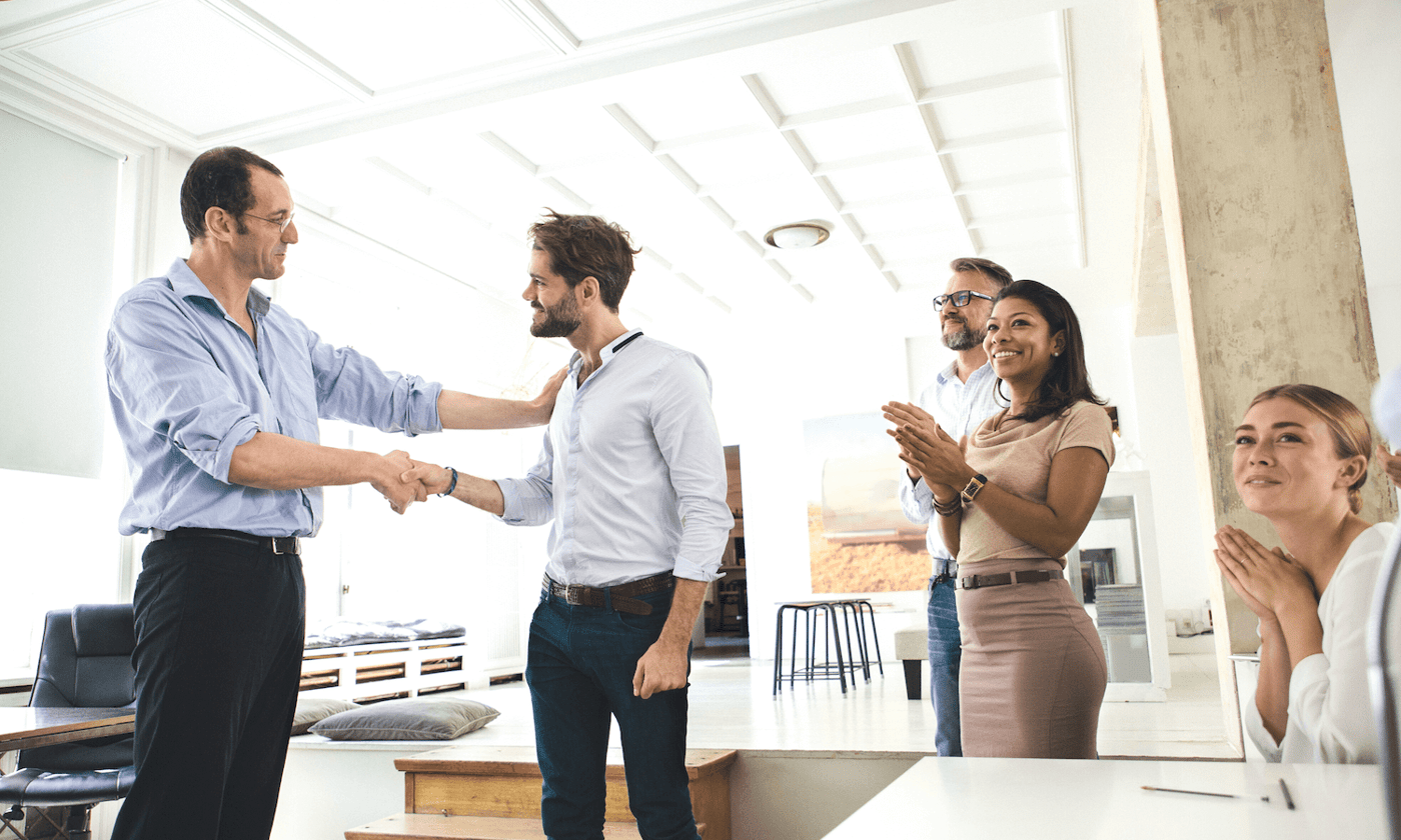 People shaking hands at awards for beyond encryption press rundown