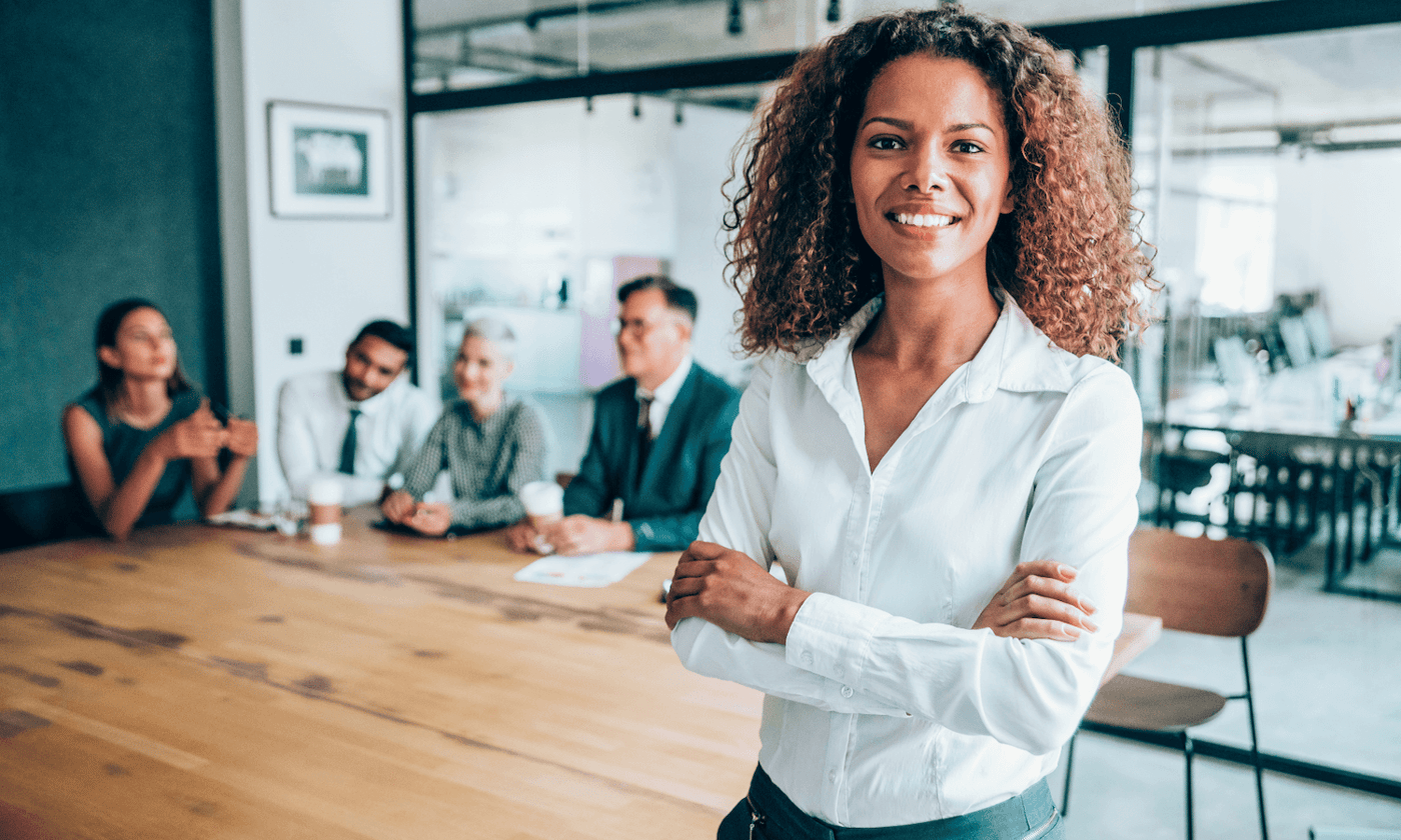 professional woman crossed arms smiling