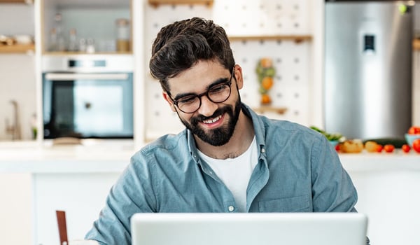man discussing mental health with team mate over video call