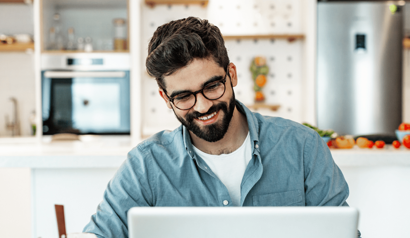 man discussing mental health with team mate over video call