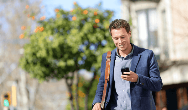 professional man looking at smartphone