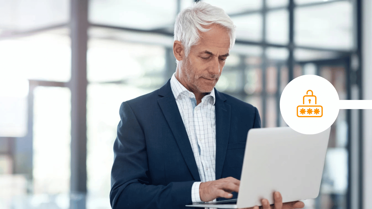 CEO looking at laptop to send secure communications